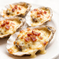 Baked oysters with cheese and bacon